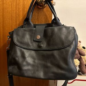 Roots Canada Black Distressed Leather.